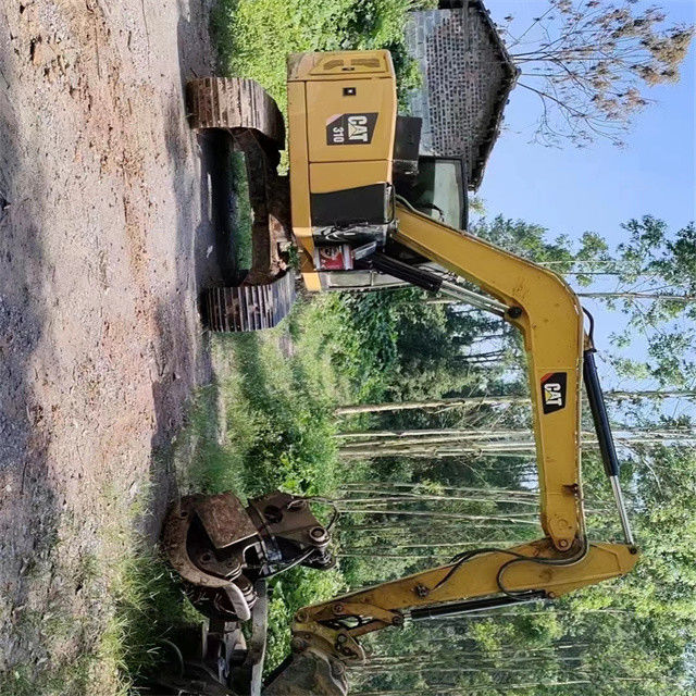 9.44 ton, neredeyse yeni, Japonya'dan ithal edilen, sürünen bir kazma makinesi, kullanılmış, yenilenmiş CAT 310