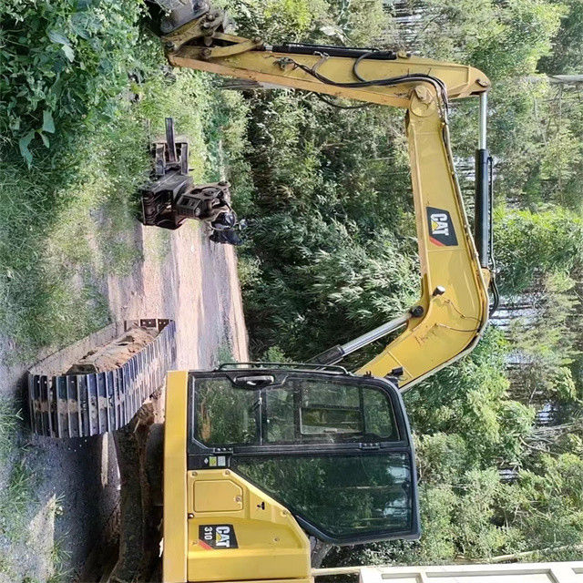 9.44 ton, neredeyse yeni, Japonya'dan ithal edilen, sürünen bir kazma makinesi, kullanılmış, yenilenmiş CAT 310