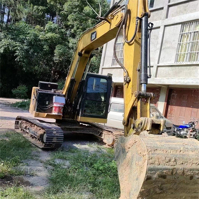 9.44 ton, neredeyse yeni, Japonya'dan ithal edilen, sürünen bir kazma makinesi, kullanılmış, yenilenmiş CAT 310