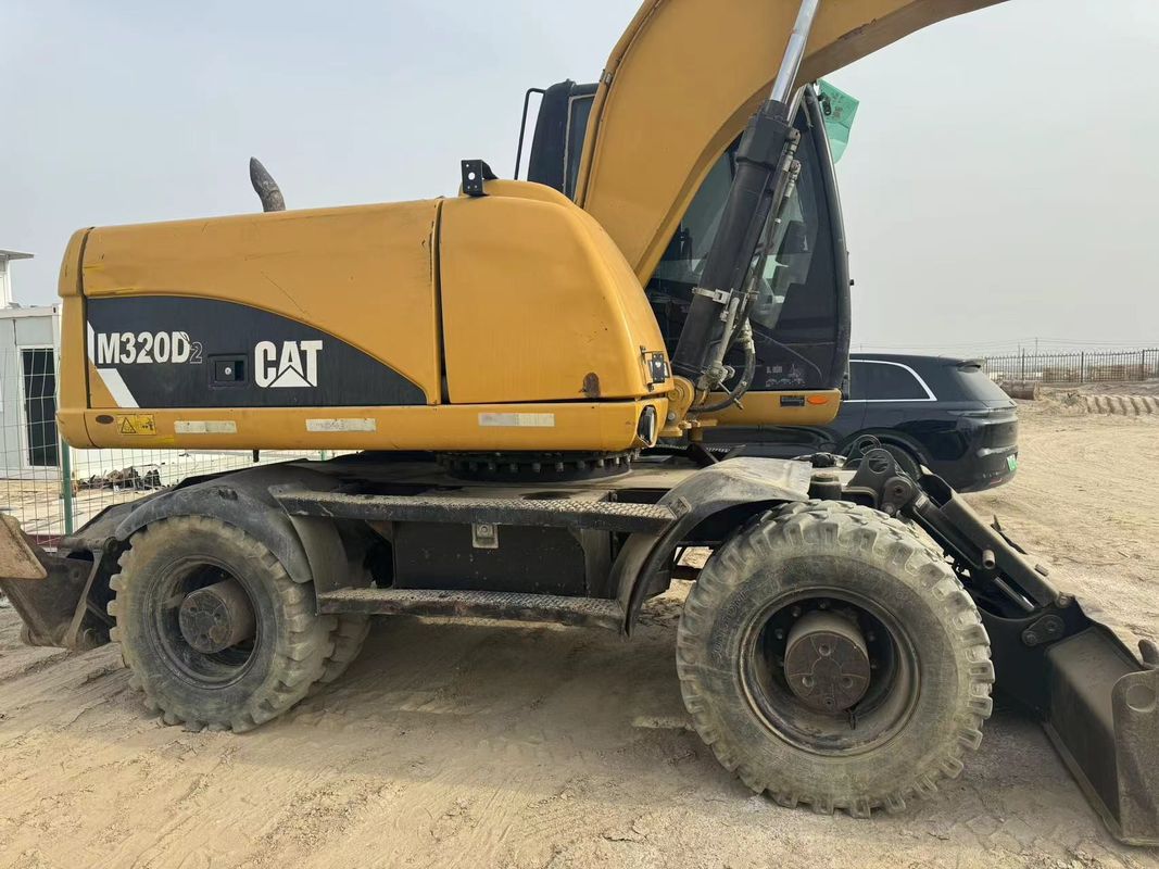 % 90 Caterpillar M317D2 Satış için yüksek kaliteli ve en iyi performanslı kullanılmış tekerlekli kazıcı